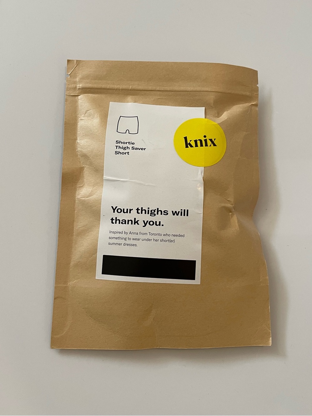 knix Shortie Thigh Saver Short Packaging — Cream with Yellow Logo